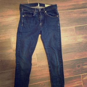 Skinny dark denim blue jeans.